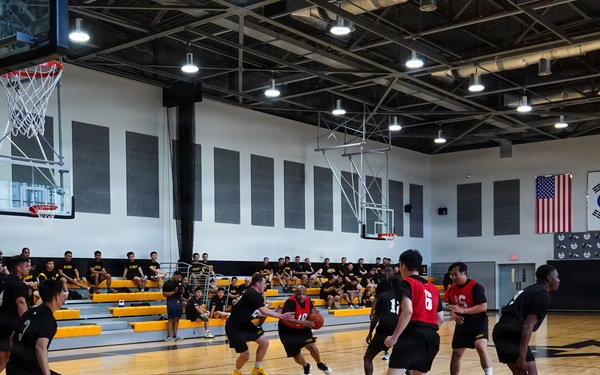 Basketball teams battle for the win