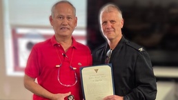 FRCSW Dong Phan Receives Coin