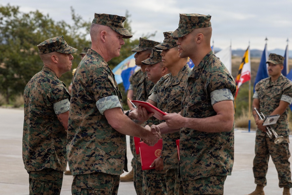 U.S. Marines with 1st MARDIV hold morning colors ceremony