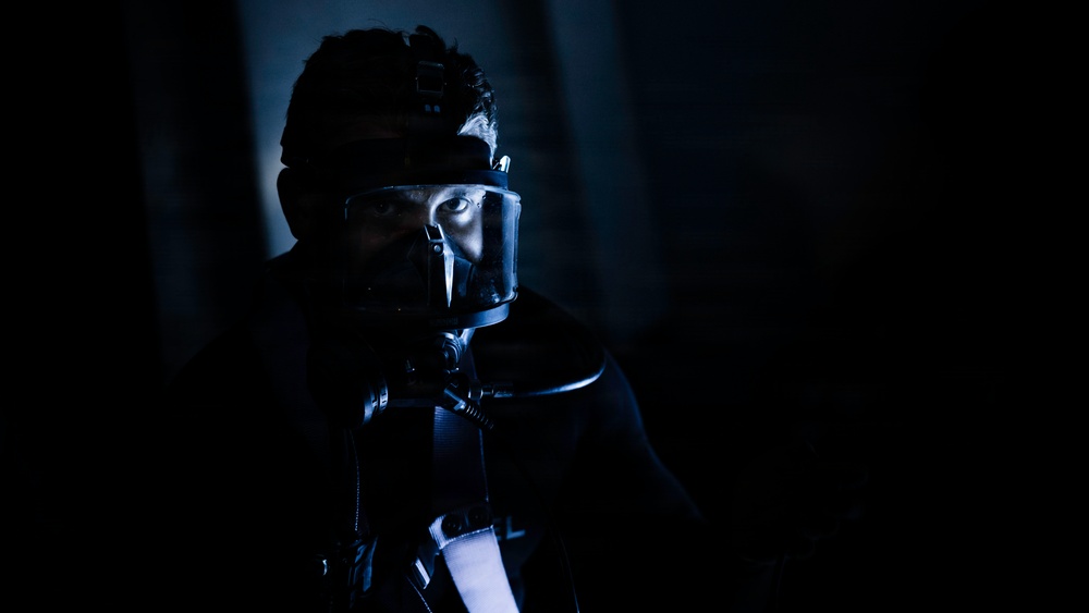 U.S. Navy Divers Conduct Ballast Tank Diving Operations