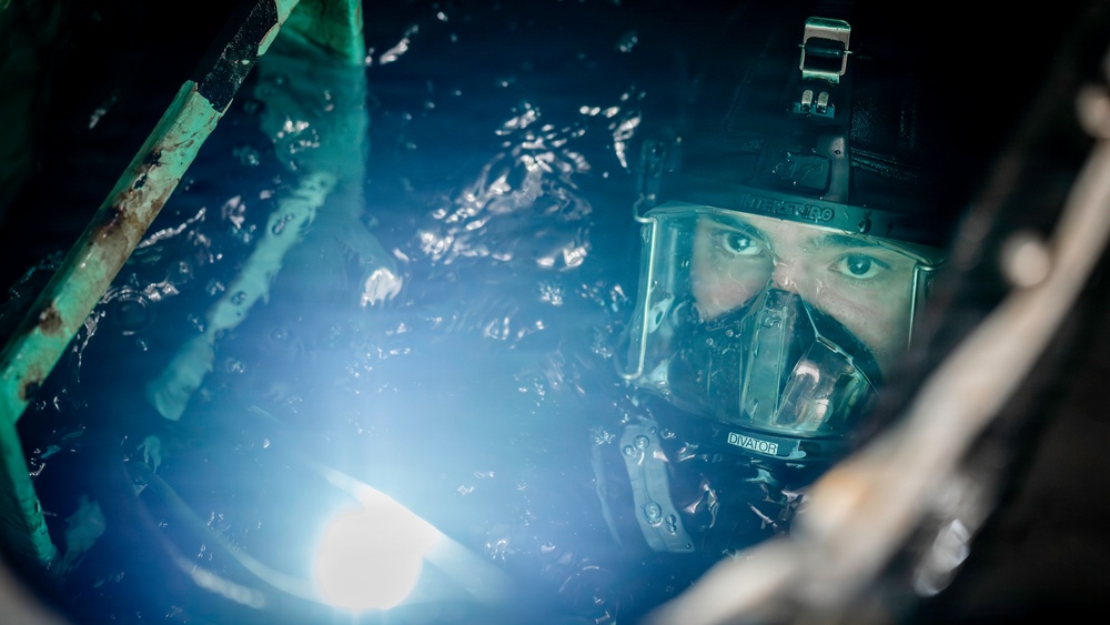 U.S. Navy Divers Conduct Ballast Tank Diving Operations