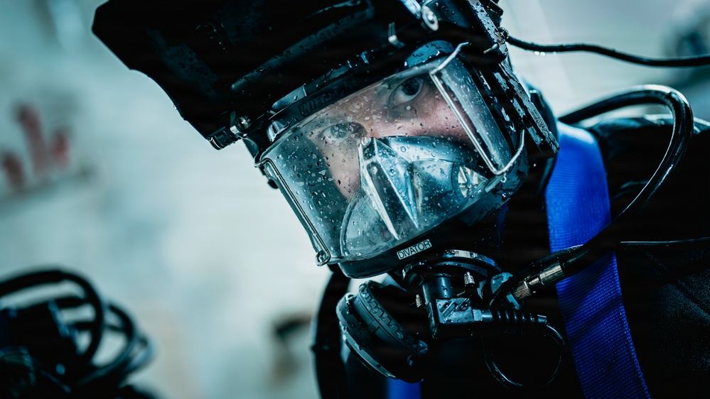 U.S. Navy Divers Conduct Ballast Tank Diving Operations