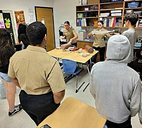 Hands-On Lifesaving Skills: Navy Corpsmen Mentor Middle School Students