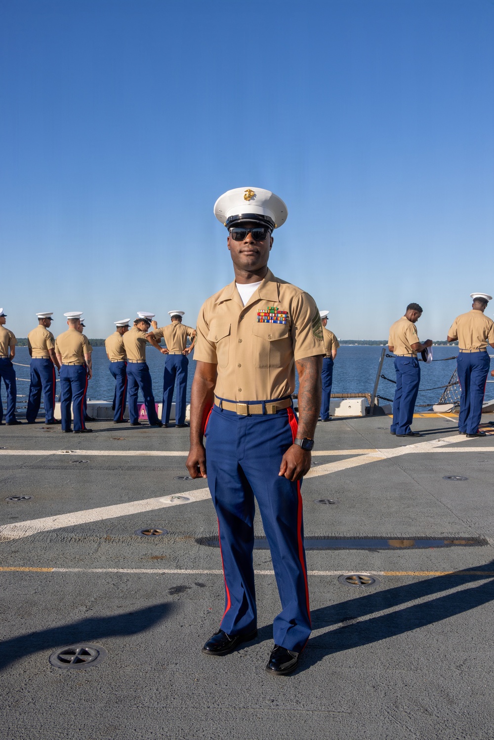 U.S. Marines and Sailors man the rails aboard the USS Arlington (LPD-24)