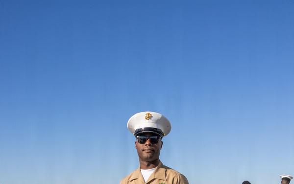 U.S. Marines and Sailors man the rails aboard the USS Arlington (LPD-24)