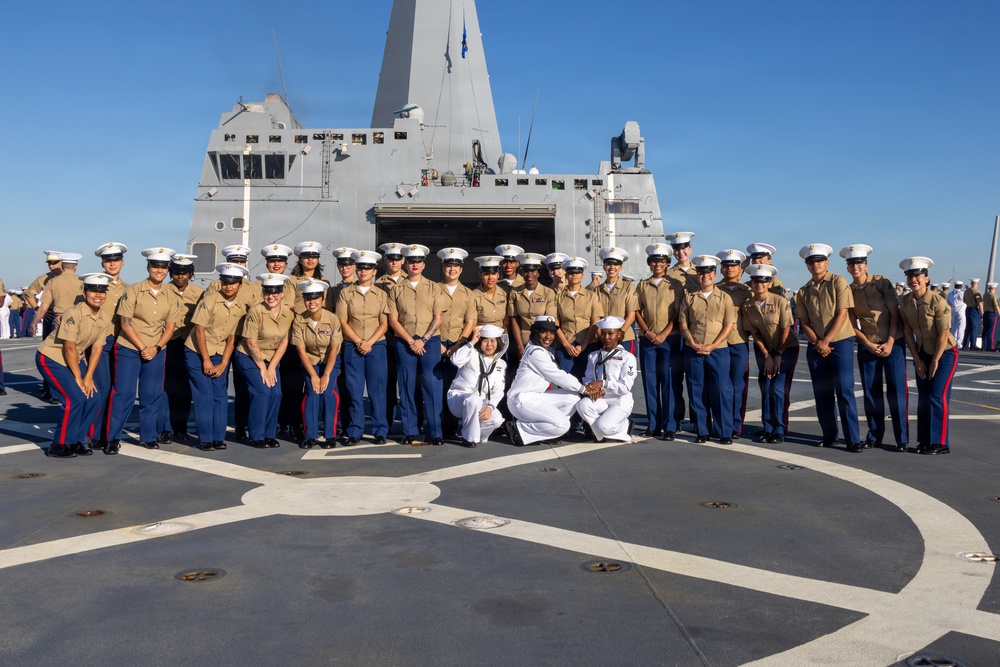 U.S. Marines and Sailors man the rails aboard the USS Arlington (LPD-24)