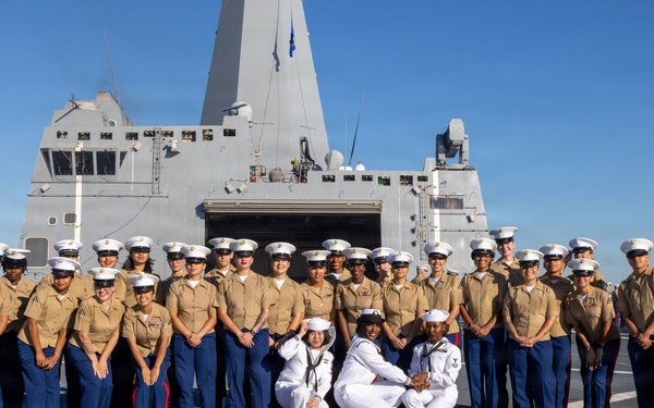 U.S. Marines and Sailors man the rails aboard the USS Arlington (LPD-24)