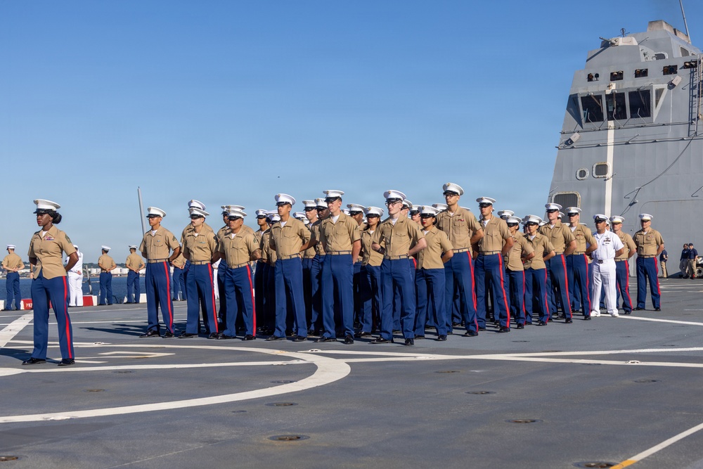 U.S. Marines and Sailors man the rails aboard the USS Arlington (LPD-24)