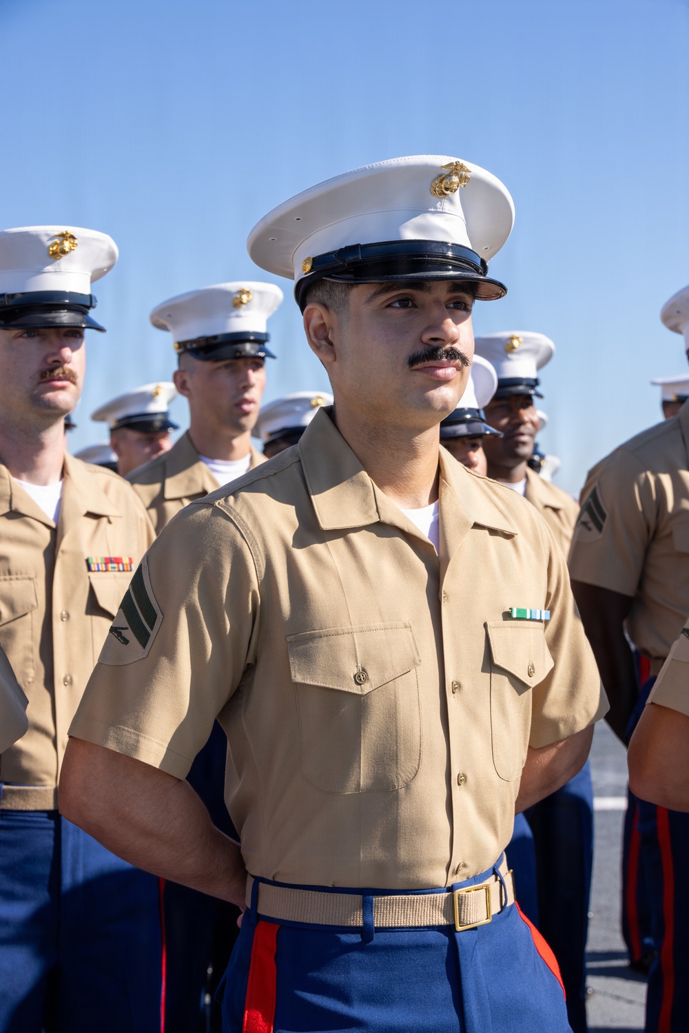 U.S. Marines and Sailors man the rails aboard the USS Arlington (LPD-24)