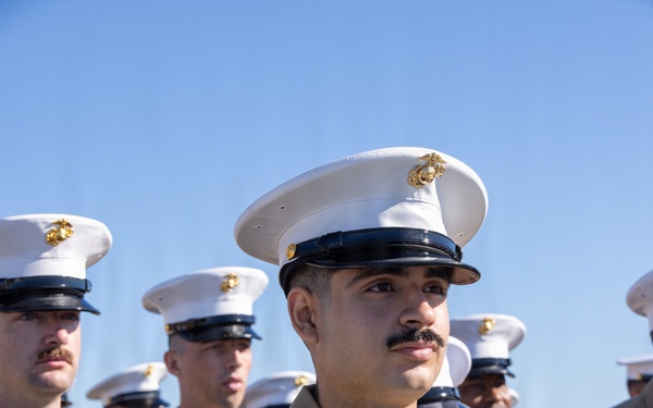 U.S. Marines and Sailors man the rails aboard the USS Arlington (LPD-24)