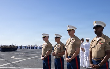 U.S. Marines and Sailors man the rails aboard the USS Arlington (LPD-24)