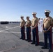 U.S. Marines and Sailors man the rails aboard the USS Arlington (LPD-24)