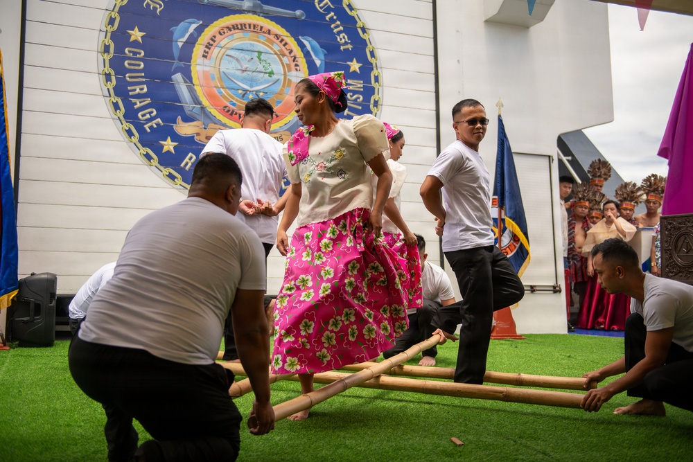 Service members attend reception onboard Philippine Coast Guard Ship BRP Gabriele Siland during RIMPAC
