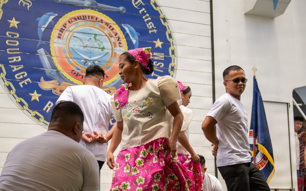 Service members attend reception onboard Philippine Coast Guard Ship BRP Gabriele Siland during RIMPAC