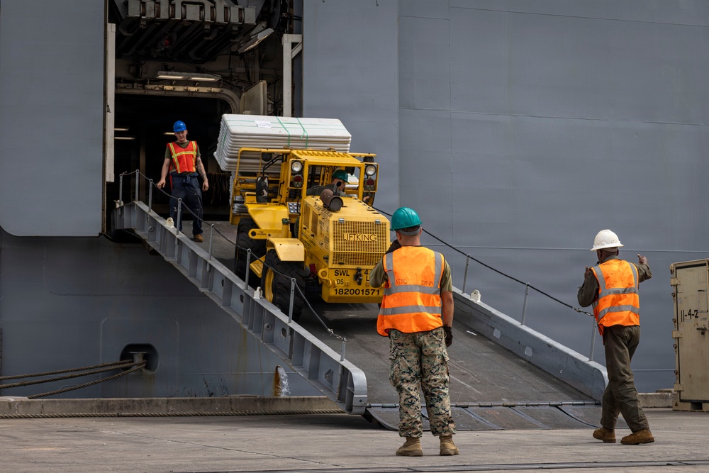 U.S. Marines aboard USS Essex offload cargo