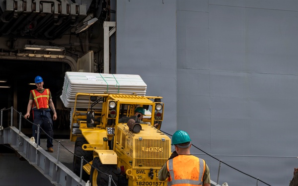 U.S. Marines aboard USS Essex offload cargo
