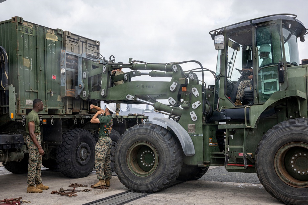 U.S. Marines aboard USS Essex offload cargo
