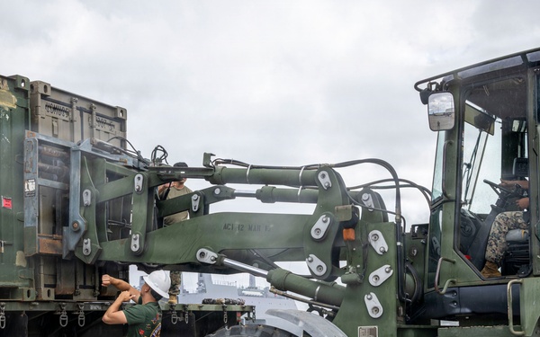 U.S. Marines aboard USS Essex offload cargo