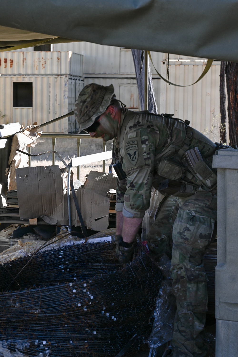 Southern Jackaroo 26: U.S. Army Soldier Unloads Barbed Wire Supply