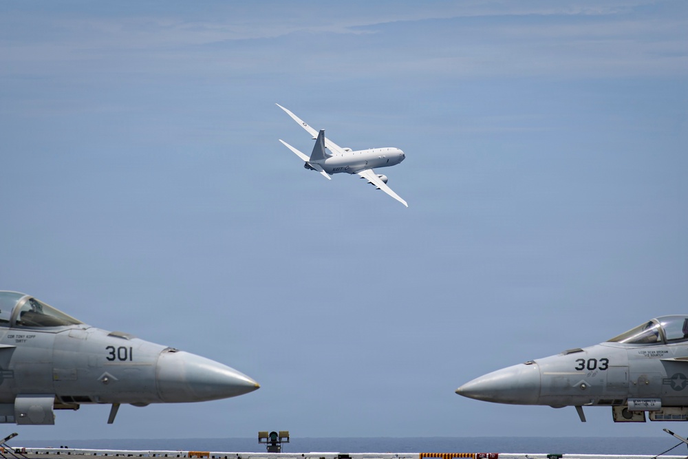 P-8A Poseidon conducts flyby over USS Nimitz (CVN 68)