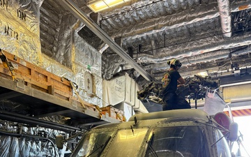 A U.S. Sailor conducts maintenance on an MH-60R Seahawk helicopter assigned to Helicopter Maritime Strike Squadron (HSM) 48, while aboard the littoral combat ship USS Billings (LCS 15) in port at Ponce, Puerto Rico, June 26, 2026.