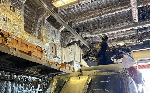 A U.S. Sailor conducts maintenance on an MH-60R Seahawk helicopter assigned to Helicopter Maritime Strike Squadron (HSM) 48, while aboard the littoral combat ship USS Billings (LCS 15) in port at Ponce, Puerto Rico, June 26, 2026.