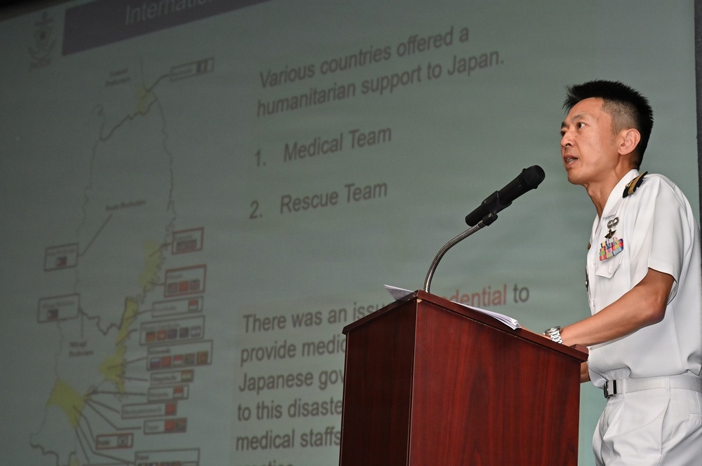 Japanese military officer briefs medical symposium during RIMPAC 26