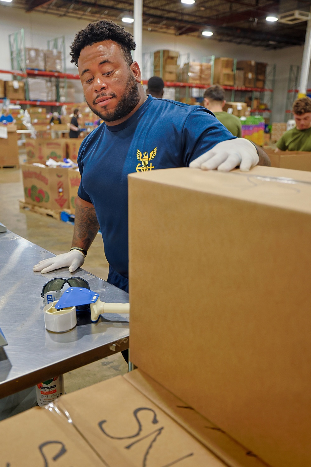 Sailors, Marines Volunteer at Maryland Food Bank During SAIL250 Maryland