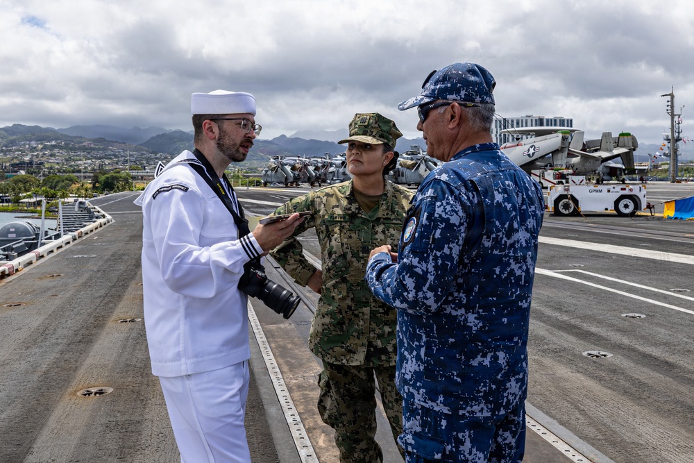 U.S. Navy and Mexican Navy leaders engage during RIMPAC 26 open ship event