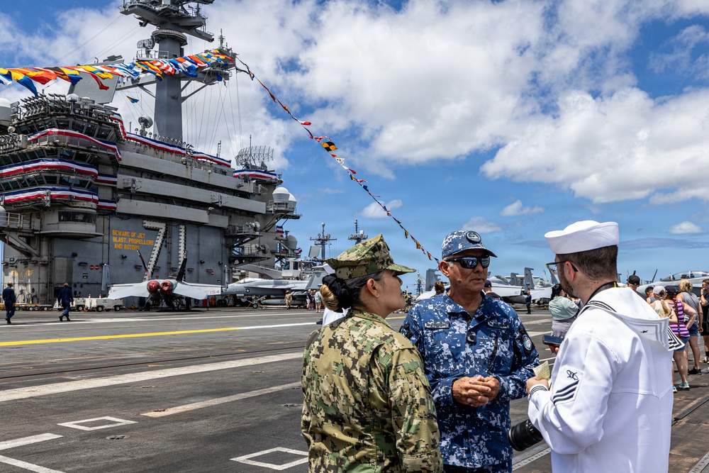 U.S. Navy and Mexican Navy leaders engage during RIMPAC 26 open ship event