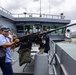 Visitor learns about weapon systems during RIMPAC 26 ship tour