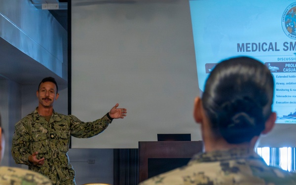 Multinational service members participate in a RIMPAC medical training