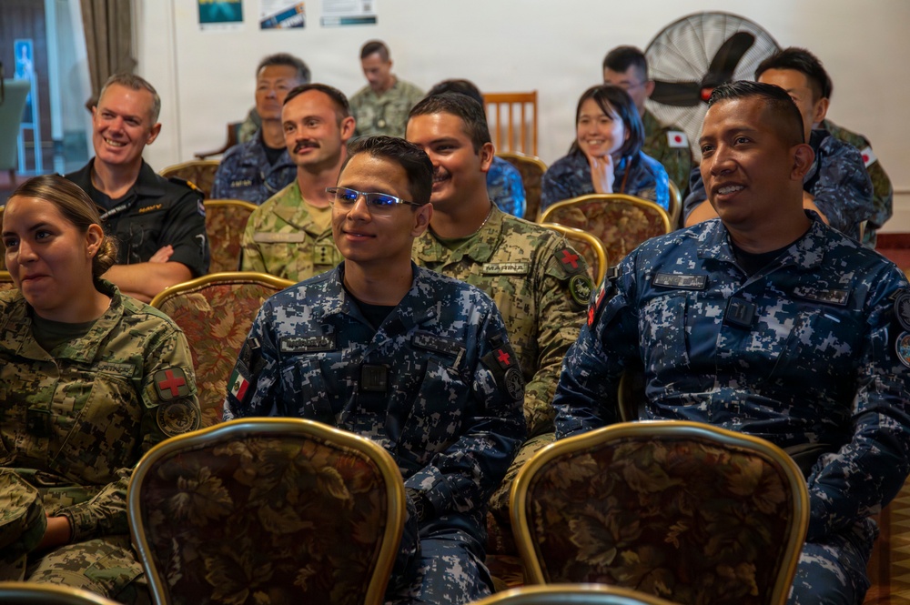 Multinational service members participate in a RIMPAC medical training