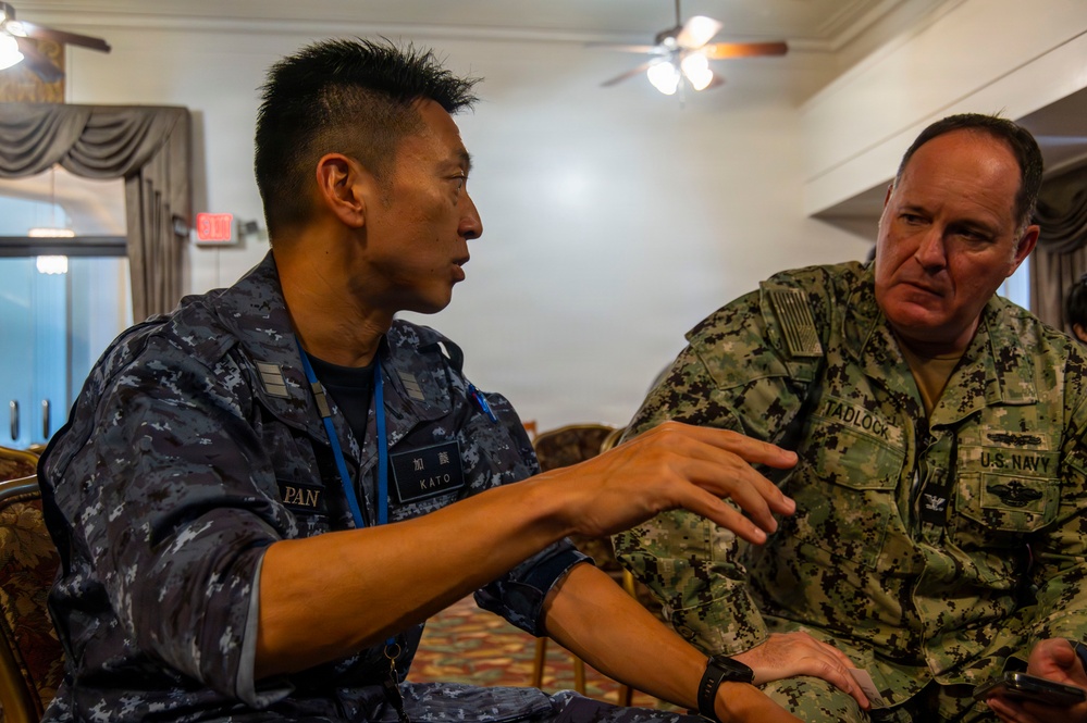 Multinational service members participate in a RIMPAC medical training