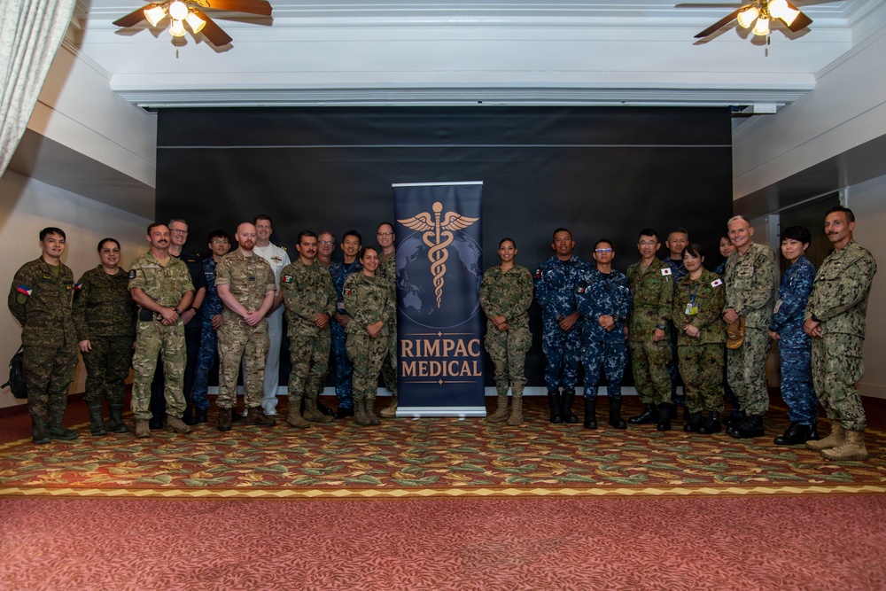 Multinational service members participate in a RIMPAC medical trainings