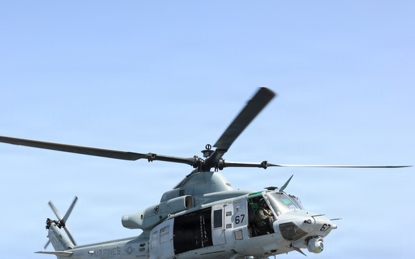 A UH-1Y Venom helicopter, assigned to Marine Medium Tiltrotor Squadron (VMM) 365 (Reinforced), Littoral Combat Force 24, lifts off.