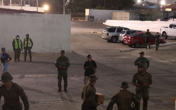 U.S. Sailors and Marines, with Littoral Combat Force 24, unload Meals, Ready-to-Eat boxes from Landing Craft Utility (LCU) 1662, assigned to Assault Craft Unit (ACU) 2, in La Guaira, Venezuela, June 27, 2026.