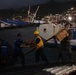 U.S. Sailors and Marines, with Littoral Combat Force 24, unload Meals, Ready-to-Eat boxes from Landing Craft Utility (LCU) 1662, assigned to Assault Craft Unit (ACU) 2, in La Guaira, Venezuela, June 27, 2026.