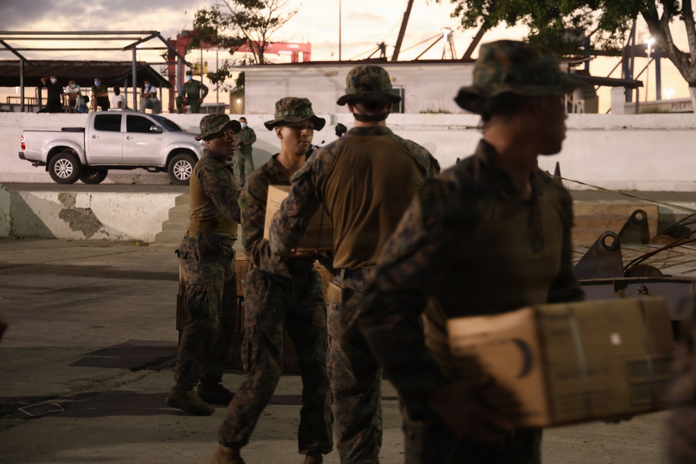U.S. Sailors and Marines, with Littoral Combat Force 24, unload Meals, Ready-to-Eat boxes from Landing Craft Utility (LCU) 1662, assigned to Assault Craft Unit (ACU) 2, in La Guaira, Venezuela, June 27, 2026.
