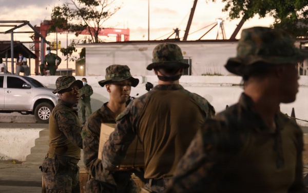 U.S. Sailors and Marines, with Littoral Combat Force 24, unload Meals, Ready-to-Eat boxes from Landing Craft Utility (LCU) 1662, assigned to Assault Craft Unit (ACU) 2, in La Guaira, Venezuela, June 27, 2026.