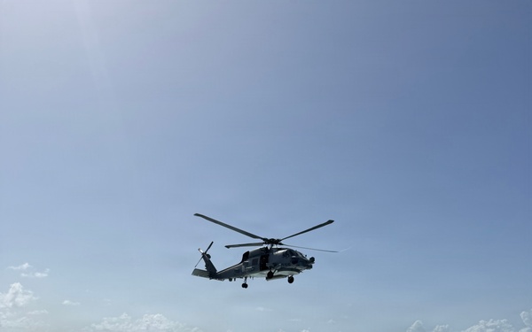 An MH-60R Seahawk helicopter assigned to Helicopter Maritime Strike Squadron (HSM) 48, lands aboard the littoral combat ship USS Billings.
