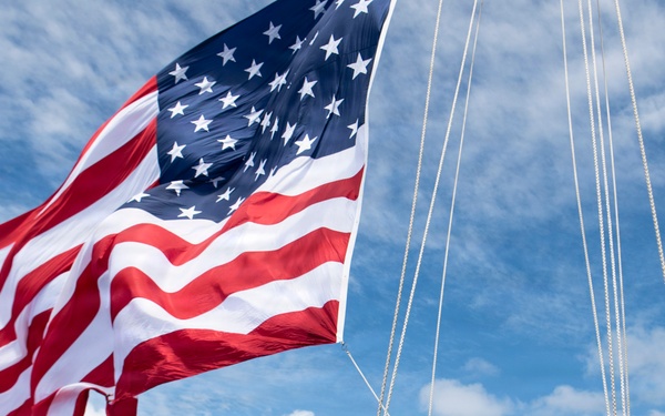 USS Boxer Hoist Battle Ensign While Sailing in Formation
