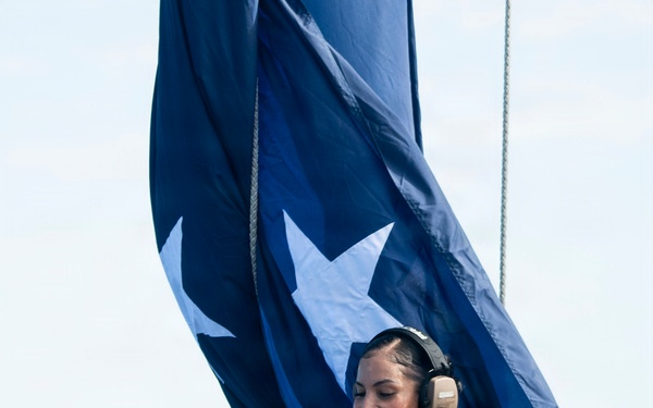 USS Boxer Hoist Battle Ensign While Sailing in Formation