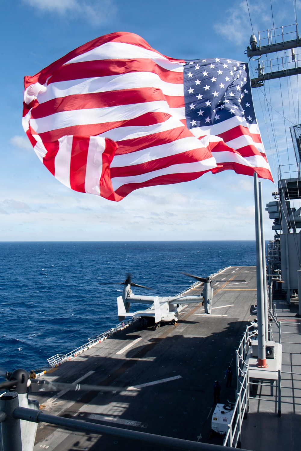 USS Boxer Hoist Battle Ensign While Sailing in Formation