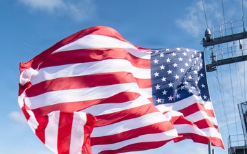 USS Boxer Hoist Battle Ensign While Sailing in Formation
