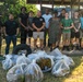 USS Theodore Roosevelt Carrier Strike Group and Carrier Air Wing 11 Sailors Participate in a Beach Clean Up During RIMPAC 26
