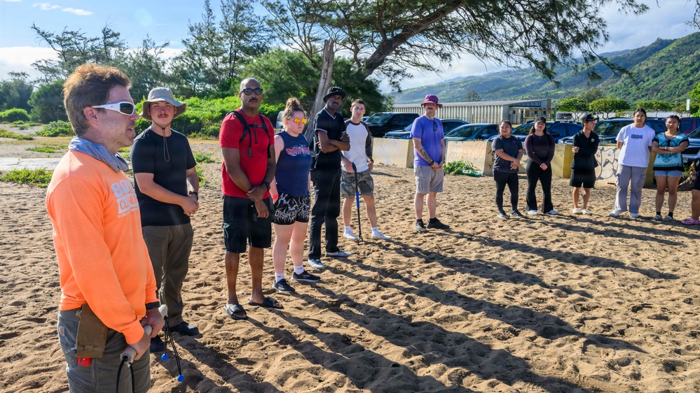USS Theodore Roosevelt Carrier Strike Group and Carrier Air Wing 11 Sailors Participate in a Beach Clean Up During RIMPAC 26