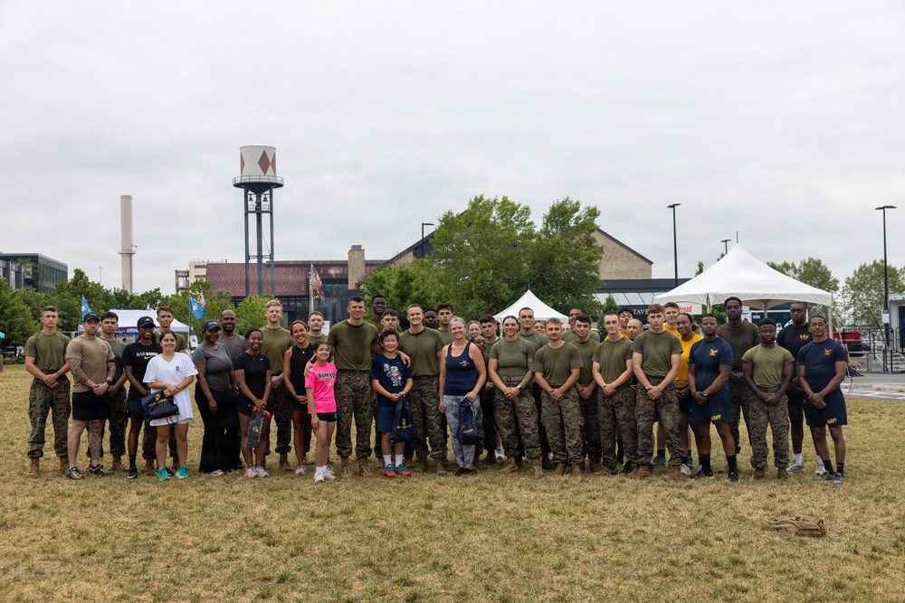 U.S. Marines and Sailors PT with the local Baltimore community during SAIL250 Maryland