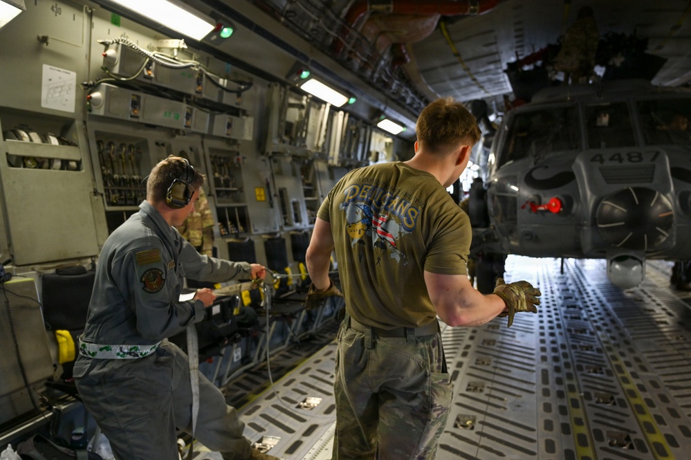 56th RGS load an HH-60W onto a C-17 for a routine deployment