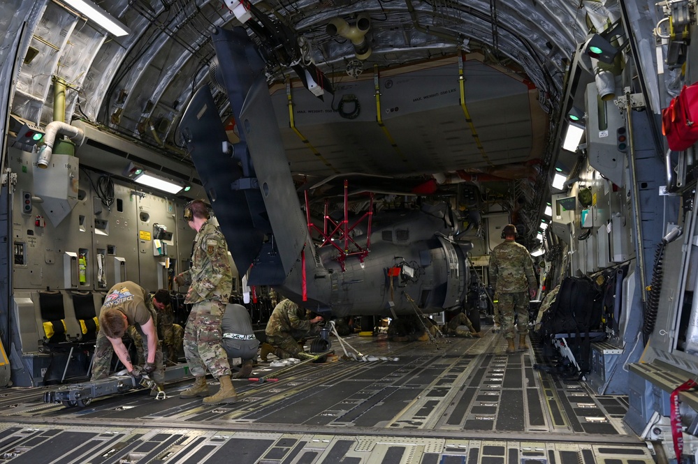 56th RGS load an HH-60W onto a C-17 for a routine deployment